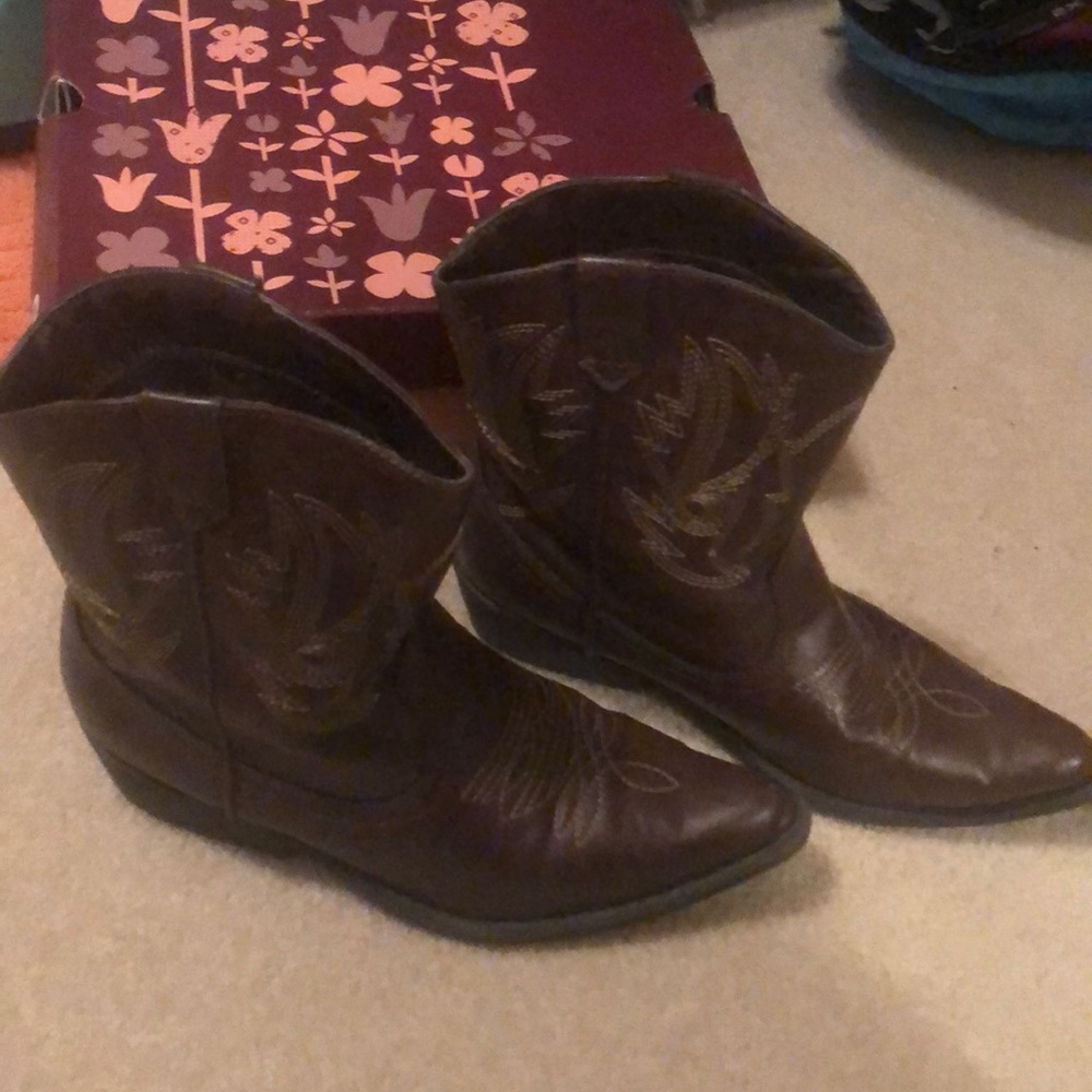 Brown ankle cowboy boots.